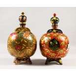 A PAIR OF 1920'S HUNGARIAN POTTER BULBOUS VASES, each with eight circular flower holes, brilliant
