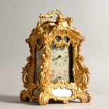 A SEVRES STYLE ORMOLU CARRIAGE CLOCK, with decorative porcelain panels. 23cms high.