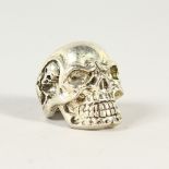 A LARGE SKULL SHAPE RING.