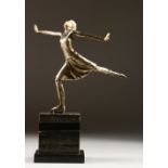AN ART DECO DESIGN SILVERED AND IVORY SKATER on a marble base.