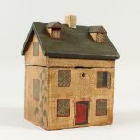 A PAINTED HOUSE STYLE TEA CADDY. 20cms high.