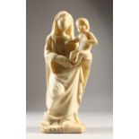 AN 18TH CENTURY ALABASTER CARVED FIGURE, MADONNA AND CHILD. Inscribed. 36cms high.