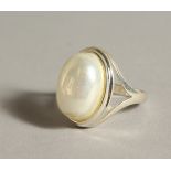 A SILVER AND PEARL RING.