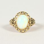 a yellow gold and opal ring.