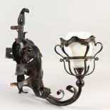 A FLORENTINE BLACK PAINTED METAL LAMP BRACKET with opaque glass shade. 46cms long.