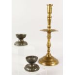 A SMALL PAIR OF PEWTER SALTS AND A CAST BRONZE CANDLESTICK. 38cms high.