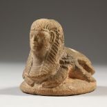 AN EGYPTIAN ANTIQUITY SEAL in sandstone. 9cms long.