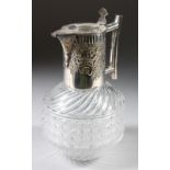 A VICTORIAN GLASS CLARET JUG, with plated spout and handle.