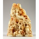A CHINESE CARVED WHITE JADE MOUNTAIN. 19cms high.
