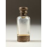 A VICTORIAN SCENT BOTTLE by S. MORDAN & CO., LONDON with silver top and vinaigrette in the base.