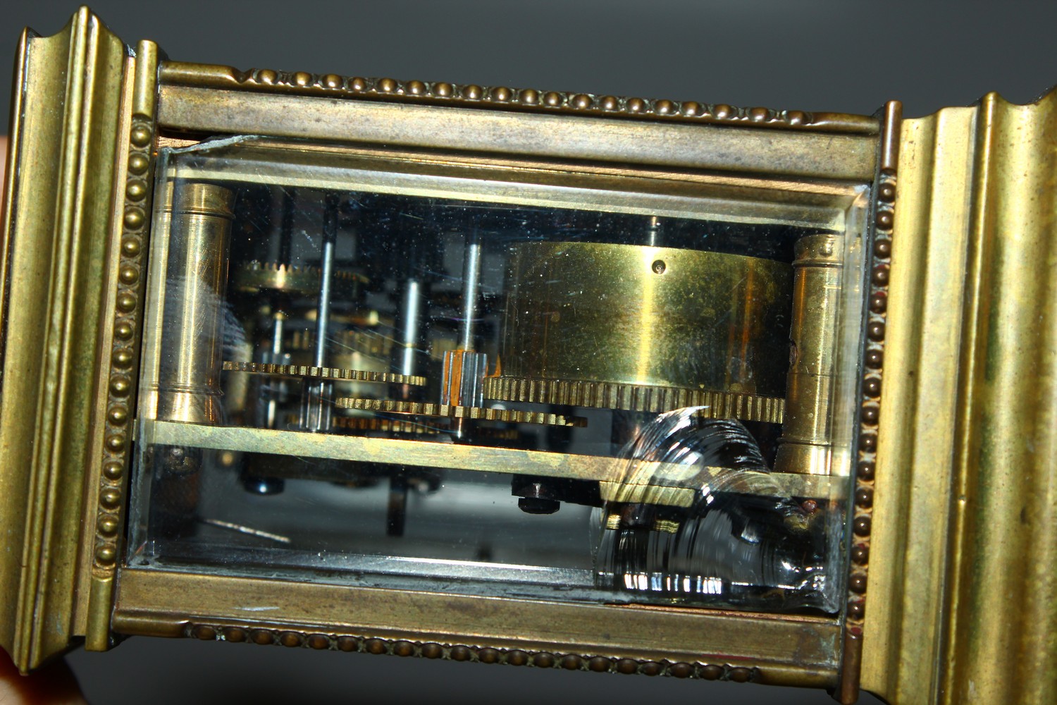 A MINIATURE BRASS CARRIAGE CLOCK, with alarm and subsidiary dial. 12cms high. - Image 3 of 7