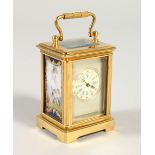 A MINIATURE FRENCH BRASS AND "SEVRES" PORCELAIN PANEL CARRIAGE TYPE CLOCK. 5.5cms high.