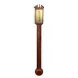 A GEORGE III MAHOGANY STICK BAROMETER by B. GATTY, READING, with brass face. 37ins long.