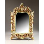 A CONTINENTAL PORCELAIN FRAMED MIRROR, with floral decoration. 24ins high x 16ins wide.