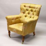 HAMPTONS OF PALL MALL, A LATE 19TH CENTURY ARMCHAIR with button upholstery, turned front legs, brass