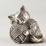 A NOVELTY SILVER CAT AND WOOL PIN CUSHION.