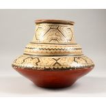 A PERUVIAN SHIPIBO CULTURE CIRCULAR POT. 21cms high x 27cms wide.