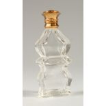 AN 18CT GOLD TOP CUT GLASS SCENT BOTTLE. 10cms high.