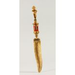 A RUSSIAN SILVER GILT AND ENAMEL LETTER OPENER, with cherb finial and feather shaped blade. 26.