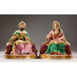 A GOOD PAIR OF FRENCH JACOB PETIT PORCELAIN FIGURES OF A SEATED TURKISH MAN AND WOMAN. J. P. in