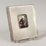 AN ENGINE TURNED CIGARETTE CASE, Birmingham 1920, with an enamel of Winston Churchill.