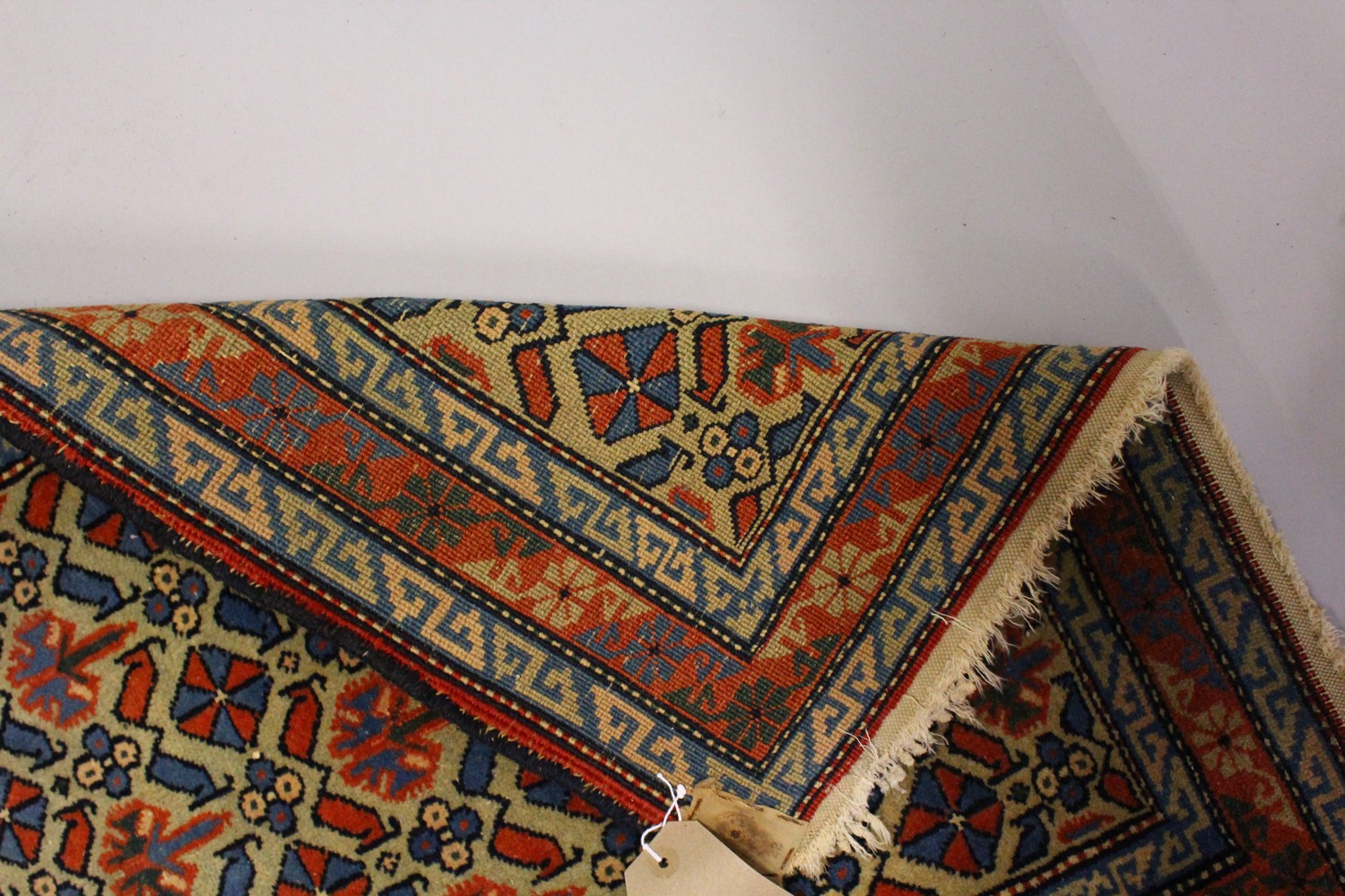 A SMALL PERSIAN RUG, beige ground with allover stylized decoration. 100cms x 65cms. - Image 5 of 6