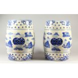 A PAIR OF CHINESE BLUE AND WHITE BARREL SHAPE GARDEN SEATS. 45cms high.