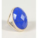 A SILVER AND LAPIS RING.