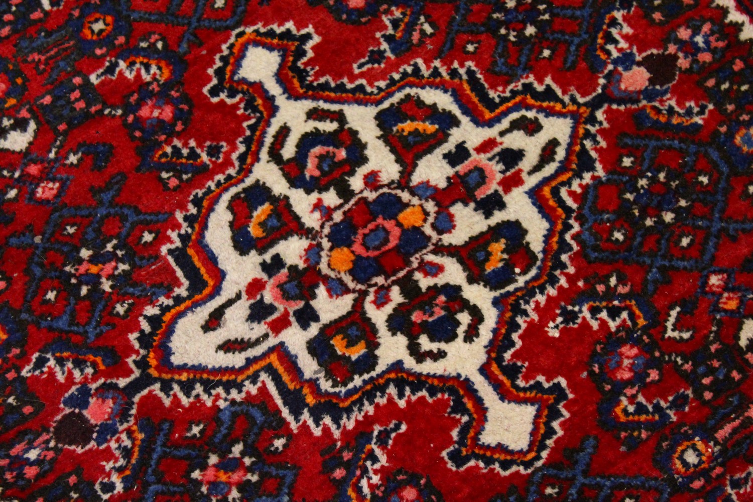 A PERSIAN RUG, red ground with central motif and similar border. 150cms x 105cms. - Image 3 of 7