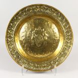AN EARLY BRASS CIRCULAR ALMS DISH "THE SPIES OF CANAAN". 45cms diameter.