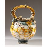 A VERY GOOD 17TH CENTURY MAJOLICA WET DRUG JAR with cupids in relief. 28cms high.