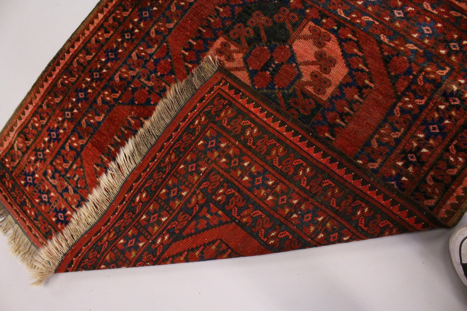 A SMALL PERSIAN RUG, rust ground with two large motifs. 106cms x 100cms. - Image 5 of 6