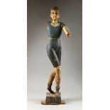 A LATE 19TH/EARLY 20TH CENTURY CARVED AND PAINTED FIGURE, of a young woman, possibly artists