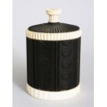A EUROPEAN CARVED IVORY MOUNTED WOODEN CIRCULAR CADDY AND COVER. 5.5ins high x 3.5ins diameter.