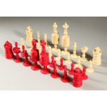 A GOOD RED AND WHITE STAINED IVORY CHESS SET. Queen 14cms high.