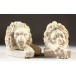 A PAIR OF CARVED MARBLE STYLE LION BOOKENDS. 14cms high.