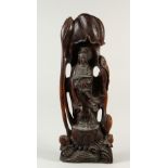 A LARGE CARVED WOOD FIGURE OF GUANYIN. 74cms high.