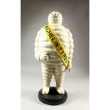 A LARGE PAINTED CAST IRON MODEL OF THE MICHELIN MAN. 60cms high.