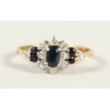 A 9CT GOLD, DIAMOND AND SAPPHIRE RING.
