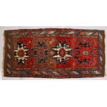 A GOOD PERSIAN RUG, with four large motifs and stylized border. 280cms x 135cms.