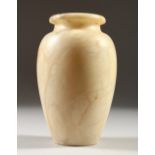 AN EGYPTIAN ALABASTER VASE. 18cms high.