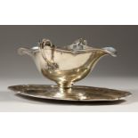 GUSTAVE KELLER. A FINE DOUBLE LIP TWO HANDLED SAUCEBOAT ON STAND. 26cms long. 23ozs.