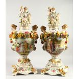 A PAIR OF MEISSEN STYLE FLORAL ENCRUSTED VASES, COVERS AND STANDS, with handles modelled as female