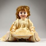 AN ARMAND MARSEILLE PORCELAIN HEADED DOLL, 1894, AM1, DEP, with articulated limbs. 32cms high.