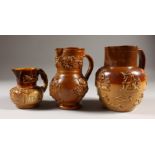 THREE VARIOUS 19TH CENTURY SALT GLAZE JUGS, one stamped BENJAMIN HAY, 1876. 16cms, 15cms and 10cms