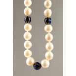 A PEARL NECKLACE, interspersed with diamond and blue enaeml balls. 49cms long.