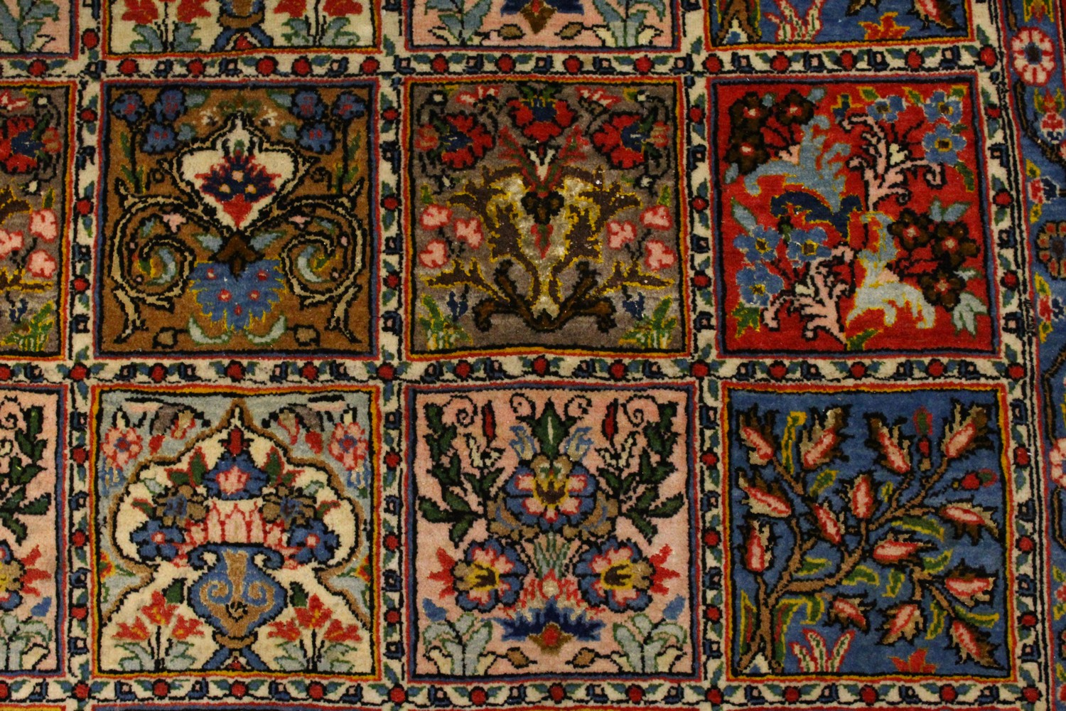 A GOOD PERSIAN RUG, with five rows of eight panels, each decorated with trees and flowers, in a - Image 5 of 8