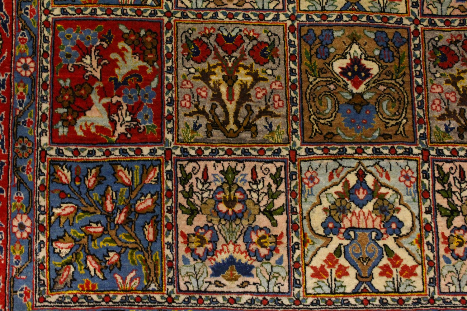 A GOOD PERSIAN RUG, with five rows of eight panels, each decorated with trees and flowers, in a - Image 4 of 8