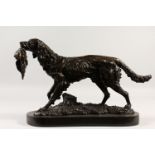 AFTER BARYE. A BRONZE RETRIEVER with a pheasant in its mouth. Signed on a marble base. 49cms long.