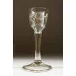 A GEORGIAN WINE GLASS with engraved bowl. 15cms high.